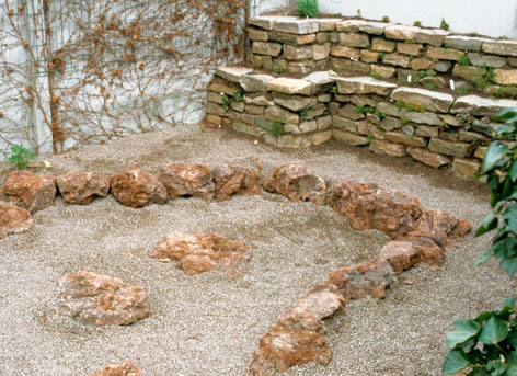 Flagstone wall and lava scree